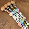 kf S0304fd6a885040cb89bd4642976d7513l - Personalised Dummy Clips UK