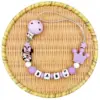 kf S859a49b7caec43bb9af6501ece359b8cY - Personalised Dummy Clips UK